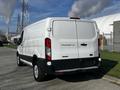 A 2017 Ford Transit 250 cargo van in white with a plain rear design and no visible branding