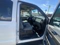2016 Ford F-350 SD with an open driver side door showing the interior features including seats dashboard and steering wheel