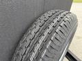 A close-up of a tire with an intricate tread pattern designed for a 2025 Shuttle Office showing detailed grooves and rubber texture