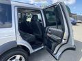 A 2006 Land Rover LR3 with its driver and passenger doors open revealing the interior seating and dashboard features