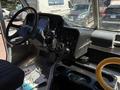 Interior view of a 2019 Freightliner MT45 showing the driver's seat steering wheel dashboard and various controls