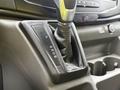 Gear shift lever of a 2023 Ford Transit with options for park reverse neutral drive and manual