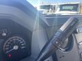 Close-up of the interior dashboard of a 2014 Ford F-250 SD showing the speedometer and control lever for various functions