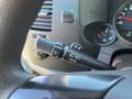 A close-up view of the turn signal and windshield wiper control stalk on the steering column of a 2013 Chevrolet Silverado 1500