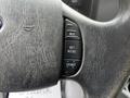 Close-up of the steering wheel of a 2018 Ford Econoline showing cruise control buttons labeled RES SET ACCEL and COAST