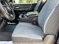 Interior view of a 2020 Ram 2500 showing front seats and center console with a cup holder