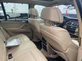 Interior view of a 2009 BMW X5 showcasing leather seats with headrests and a central console
