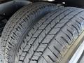 Close-up of two tires from a 2019 Ford Econoline showing detailed tread patterns and sidewalls