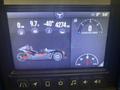 A digital display showing a 2020 Polaris SlingShot with various metrics including speed voltage and kilometers traveled