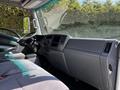 Interior view of a 2007 GMC W3500 showing the driver's seat dashboard and steering wheel with gray upholstery and controls