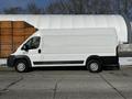 A 2017 RAM Promaster van in white color with a plain exterior design and black accents on the lower part of the vehicle