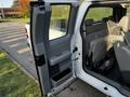 A 2008 Ford F-150 XL with the driver's side door open revealing gray interior seating and door panel details