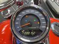 A close-up view of the speedometer and dashboard of a 2024 Harley Davidson Fat Boy showing various indicators and a digital odometer reading 000152 km