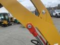Close-up of the hydraulic arm of a 2024 AGT KRW 23 Mini loader showcasing its yellow metal structure and red connection points