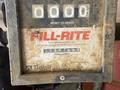 A dirty Fill-Rite fuel meter displaying numbers with a label that includes maximum pressure and total liters indicated on a gray and black background