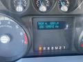 Dashboard of a 2014 Ford F-250 SD showing trip information with odometer reading and RPM gauge