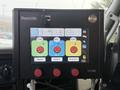 A digital control panel displaying buttons for speed, gate, and flow controls with various dials and indicators