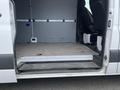A 2025 Mercedes-Benz Sprinter van with an open side door revealing a spacious interior and two front seats