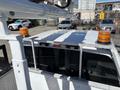 2016 Ford F-550 truck with a white cab and orange lights mounted on top
