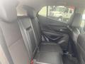 A 2018 Buick Encore featuring black leather seats in the back row with a modern design and ample legroom