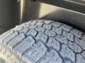 Close-up of a tire tread from a 2011 RAM 1500 highlighting the deep grooves and texture designed for traction and grip