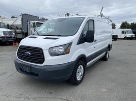 2017 Ford Transit van with a white exterior and black front grille parked in a lot