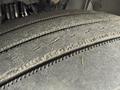 Close-up of a worn tire on a 2012 Volvo VNL showing visible tread patterns and signs of use