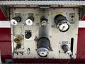 Control panel of a 2006 Emergency One Fire Truck featuring various valves gauges and switches for operating fire suppression equipment