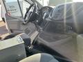 Interior of a 2016 Ford Transit showing the driver's seat steering wheel and dashboard controls