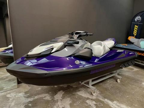 A 2025 Sea-Doo GTI SE 170 jet ski with a purple and gray color scheme featuring a sleek design and comfortable seating