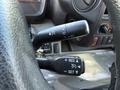 Close-up of the steering wheel controls in a 2014 Hino 195 featuring buttons for cruise control and other functions