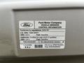 2009 Ford Econoline vehicle emission control information label including details about compliance and fuel type