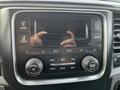 Dashboard of a 2015 RAM 1500 featuring a touchscreen display and various control buttons for audio and media settings