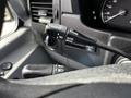 Close-up of the steering wheel controls in a 2017 Mercedes-Benz Sprinter featuring buttons for cruise control and other driving functions