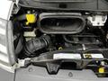 The image shows the engine compartment of a 2018 RAM Promaster highlighting various components including the air intake and coolant reservoir