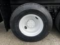 A close-up of a Michelin tire mounted on a white rim for a 2008 International 7500 truck showing tread pattern and wheel details