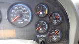 Dashboard of a 2012 International DuraStar 4300 displaying gauges for speed, fuel, voltage, air brake pressure, and engine temperature