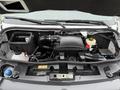 The engine compartment of a 2019 Mercedes-Benz Sprinter featuring the engine, various fluid reservoirs, and components like the air intake and battery