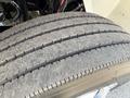 A close-up of a heavily worn tire from a 2017 International 4300 showing visible tread wear and dirt accumulation