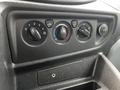 Control panel of a 2017 Ford Transit 350 showing knobs for air conditioning and ventilation settings