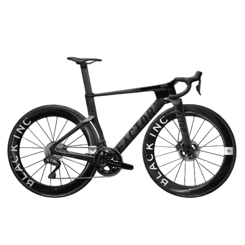 2026 Factor One Campagnolo Super Record Carbon Aero Road Bike featuring a sleek black frame and distinctive wheels with "BLACK INC" branding