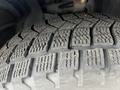 Close-up of a tire tread from a 2022 Dodge Charger showing deep grooves and textured surface designed for traction on various road conditions