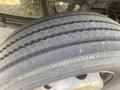 Close-up of a worn tire from a 2007 Morgan Olson Workhorse W42 featuring visible tread patterns and dust on the surface