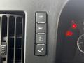 Close-up of the control panel in a 2019 Chevrolet Express featuring four buttons for various vehicle functions and an air vent