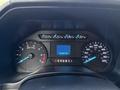 Dashboard of a 2018 Ford F-350 showing speedometer fuel gauge and odometer indicating 163347 km