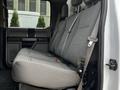 A gray fabric seat in a 2018 Ford F-450 SD pickup truck with seat belts and a high back design