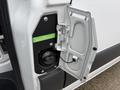A close-up view of the fuel filler cap and door on a 2019 Mercedes-Benz Sprinter showing the diesel fuel inlet and a green label indicating diesel fuel type