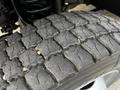 Close-up of a worn tire tread from a 2016 Ford F-550 showing deep grooves and rough texture