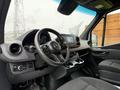 Interior view of a 2019 Mercedes-Benz Sprinter showcasing the steering wheel dashboard and controls
