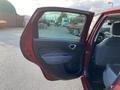 Red 2015 Fiat 500L with an open front door showcasing its interior features and space